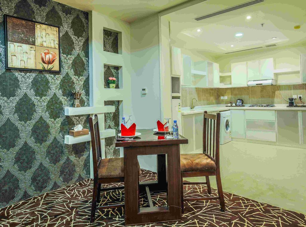 Rest Night Serviced Apartments- Alhamra Riade Exterior foto A kitchen in a hotel suite